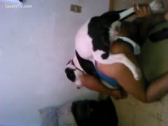 The woman is acting like a true wench while fucking his dog.